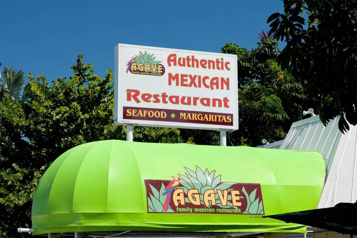 Bright green dome awning with the Agave logo under an Authentic Mexican Restaurant sign