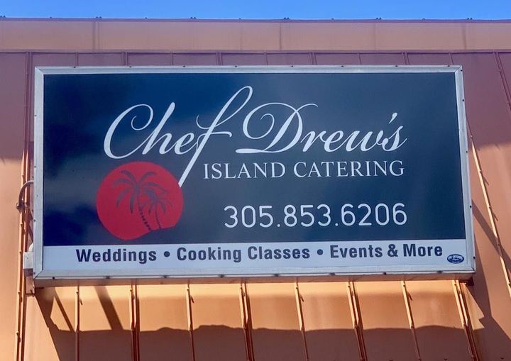 Chef Drew's Island Catering sign on a building