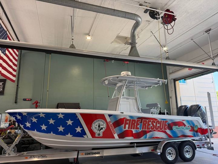 Fire rescue boat wrapped in stars and stripes on a trailer