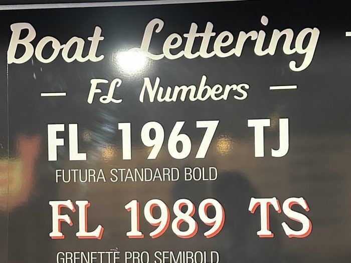 Shop sample board of FL registration numbers in different lettering styles