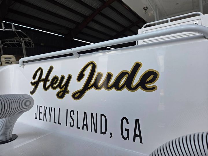 Hey Jude script boat name in black and gold with a Jekyll Island GA hailing port