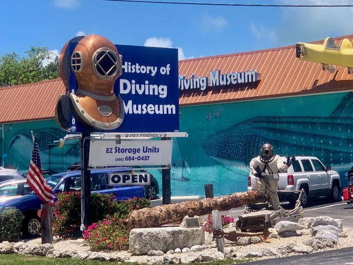 History of Diving Museum sign with a giant brass dive helmet