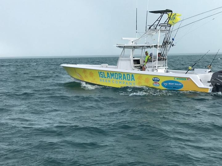 Center console wrapped in yellow with Islamorada Beer Company graphics