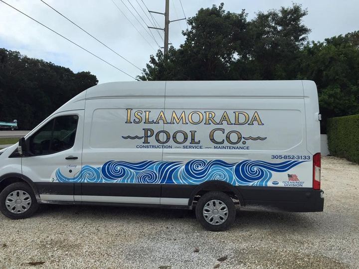 White van with Islamorada Pool Co lettering and a wave graphic
