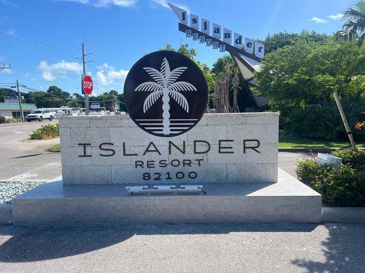 Islander Resort monument sign with raised lettering, a palm tree logo and an LED cabinet