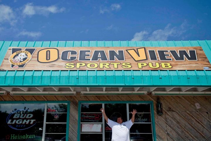 Ocean View Sports Pub sign across a storefront roofline