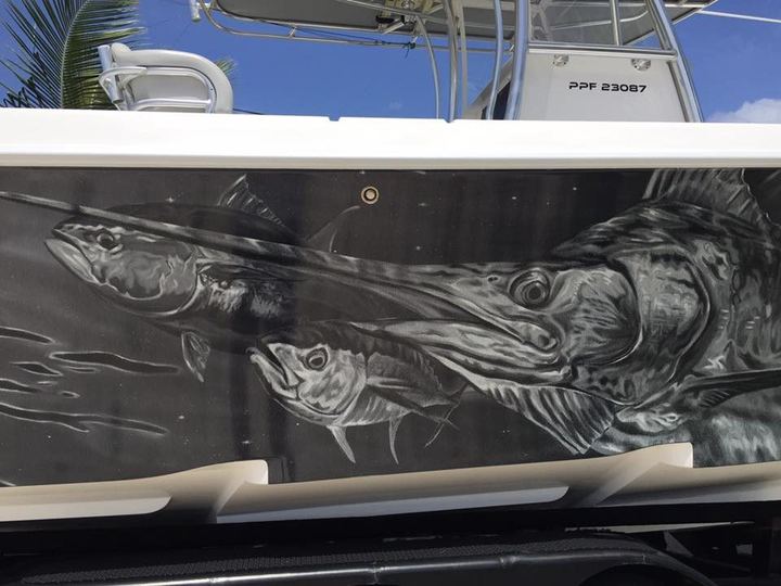 Close up of charcoal gray game fish art on a hull
