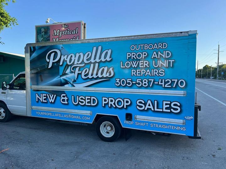 Box truck wrapped in blue for Propella Fellas outboard prop and lower unit repairs