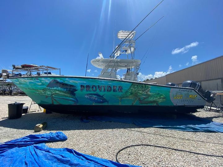 Center console on stands with an ocean wrap lettered Provider