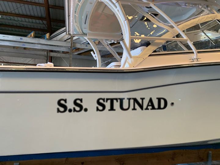 S.S. Stunad boat name in black block letters