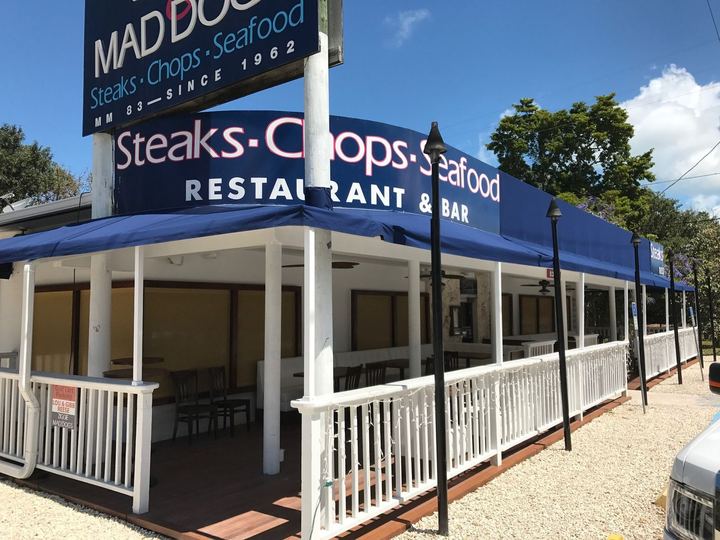 Navy awning along the porch at Ziggie and Mad Dog's