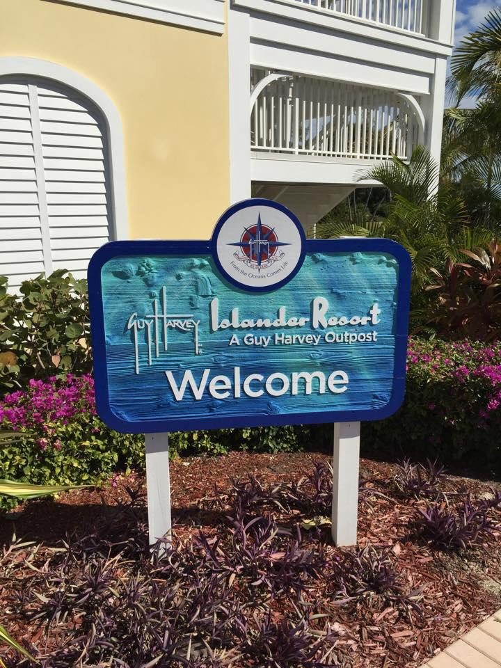 Carved Islander Resort, A Guy Harvey Outpost welcome sign