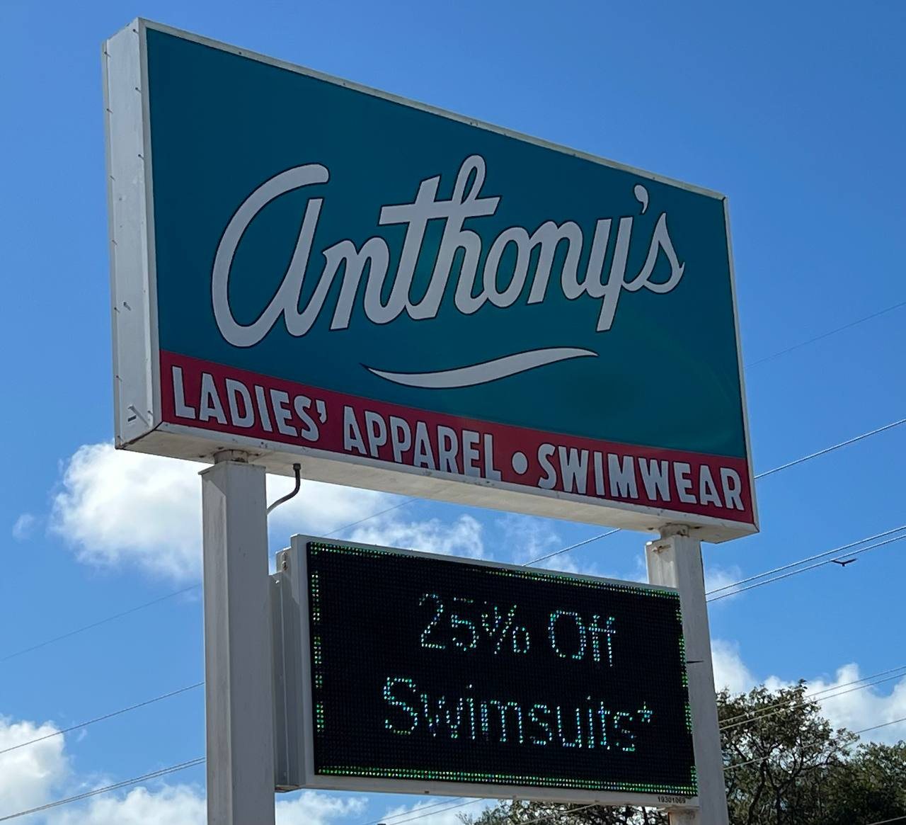 Anthony's Ladies' Apparel and Swimwear pole sign with an LED message board