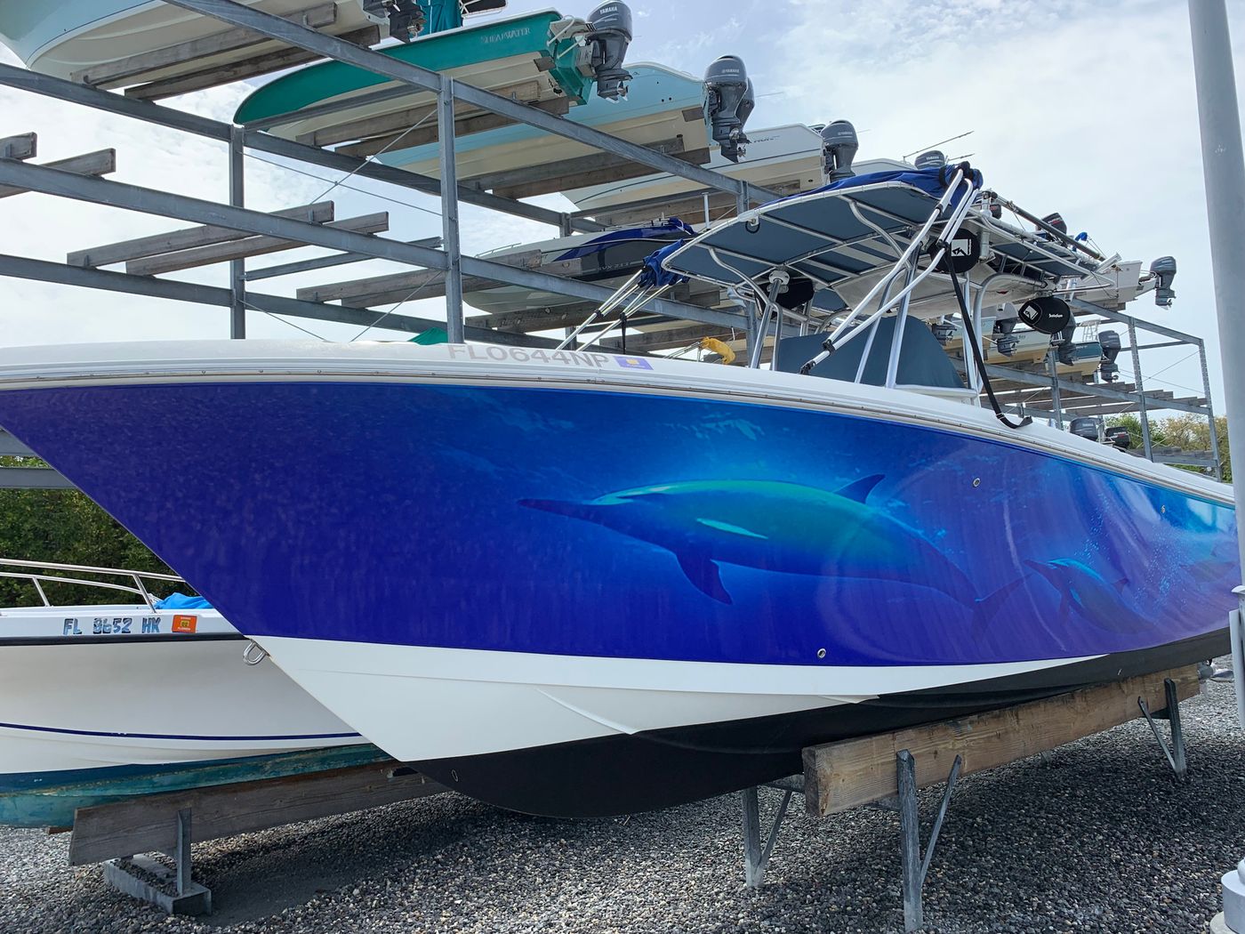 Center console on a lift with a deep blue shark wrap
