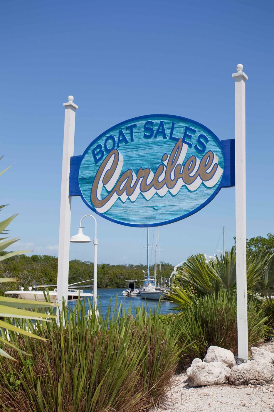 Caribee Boat Sales pole sign by the marina