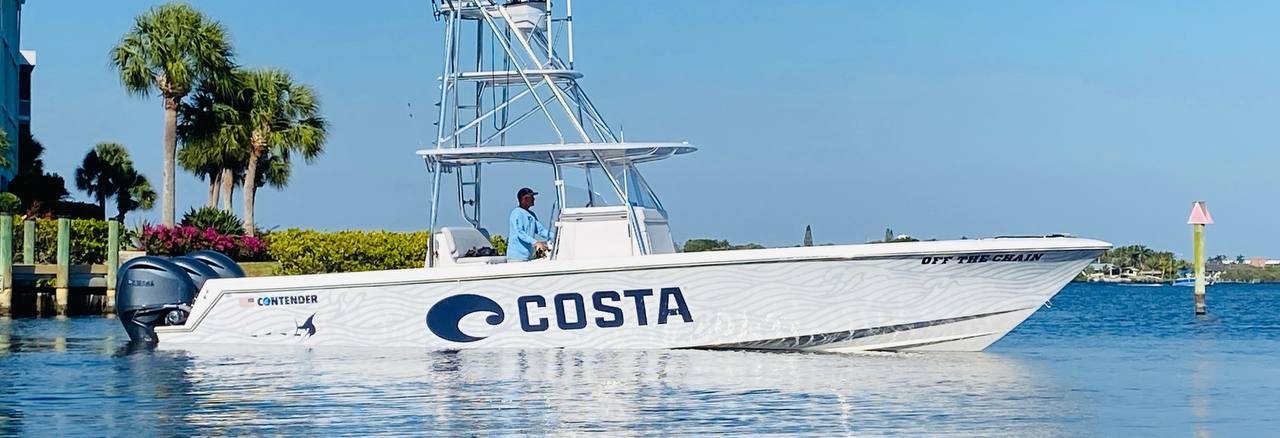 Contender center console running with a white and blue Costa wrap