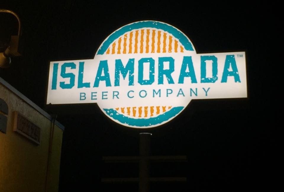 Lit Islamorada Beer Company sign at night