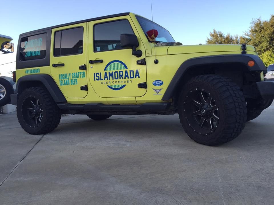 Yellow Jeep with Islamorada Beer Company graphics