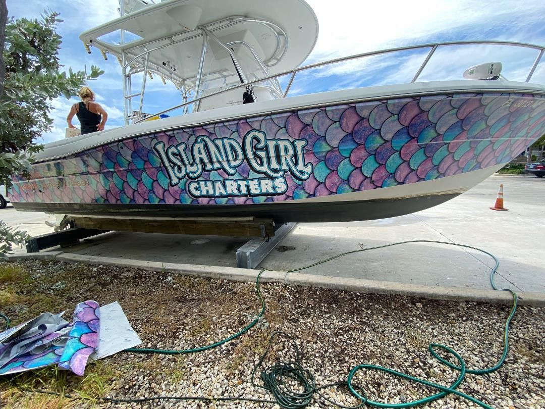 Island Girl Charters lettering on a printed hull