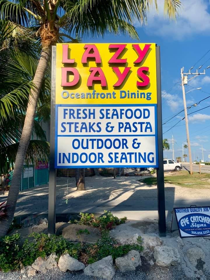 Lazy Days Oceanfront Dining pole sign