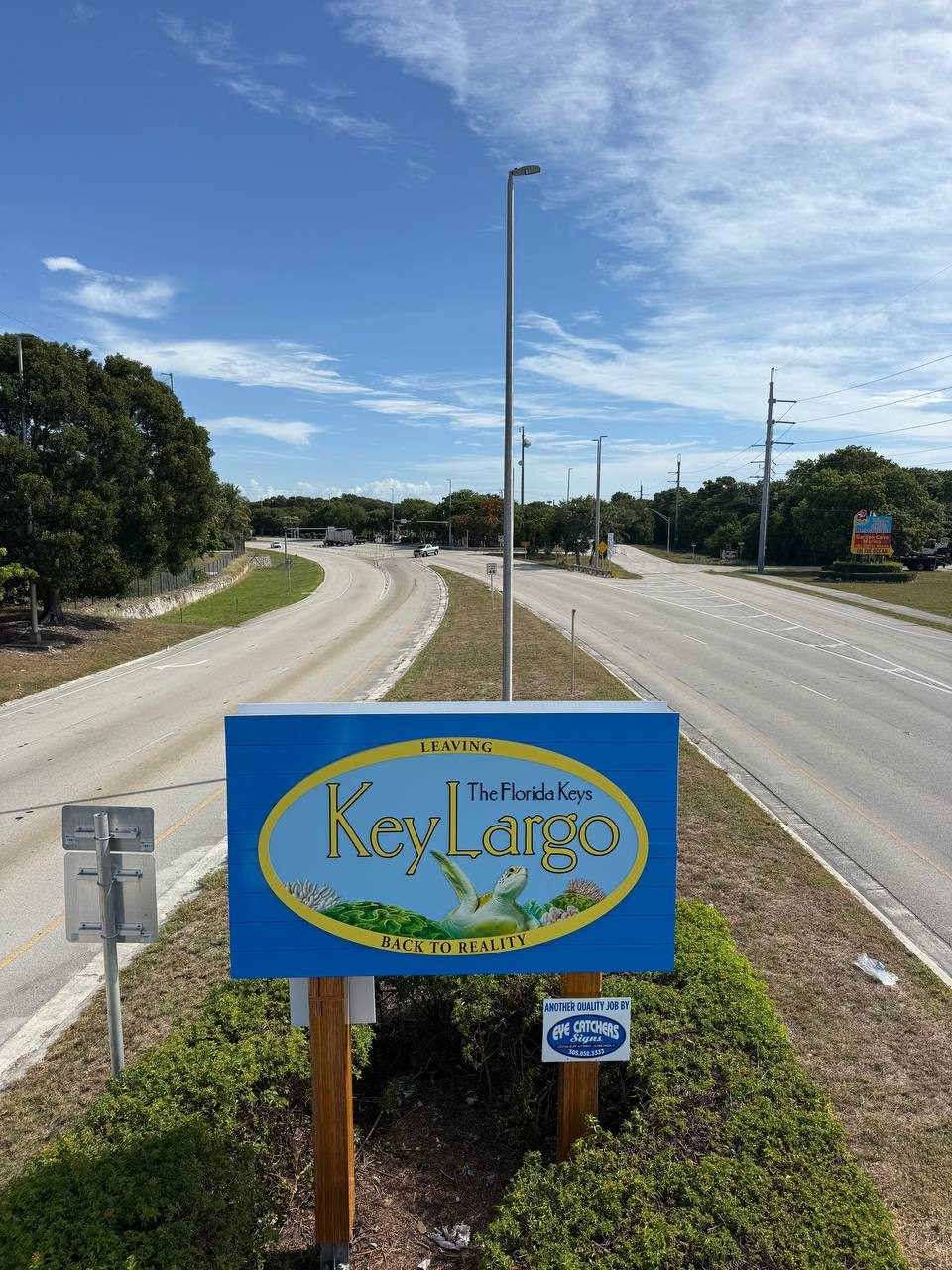 Leaving the Florida Keys Key Largo Back to Reality sign beside US-1