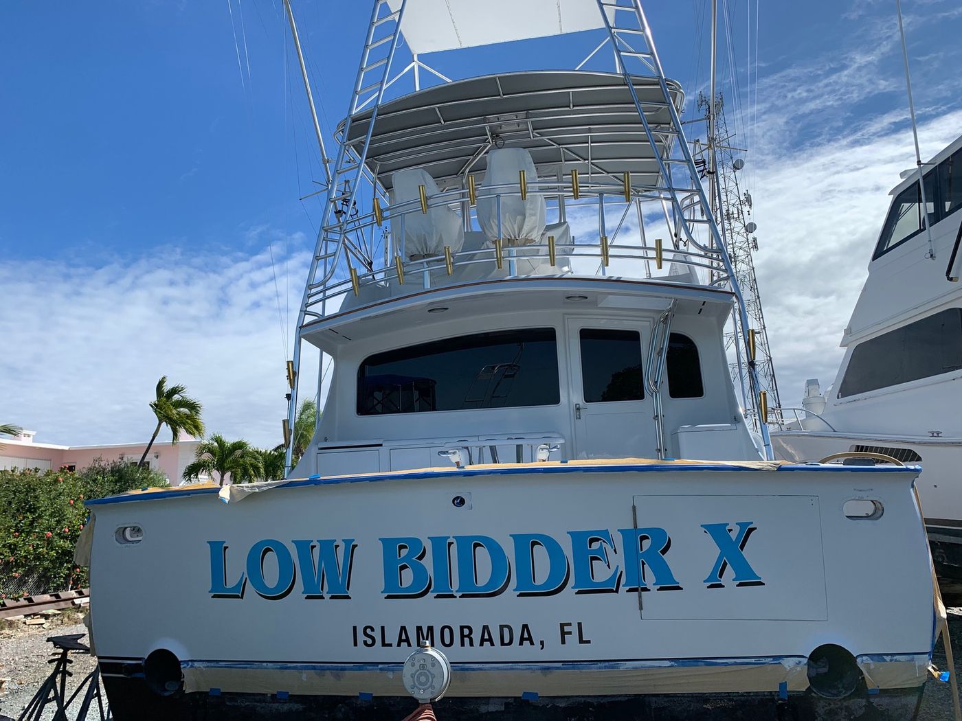 Sportfisher with Low Bidder X boat name and Islamorada FL hailing port