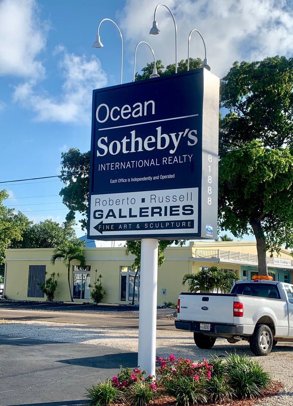 Ocean Sotheby's International Realty pole sign with a Galleries panel