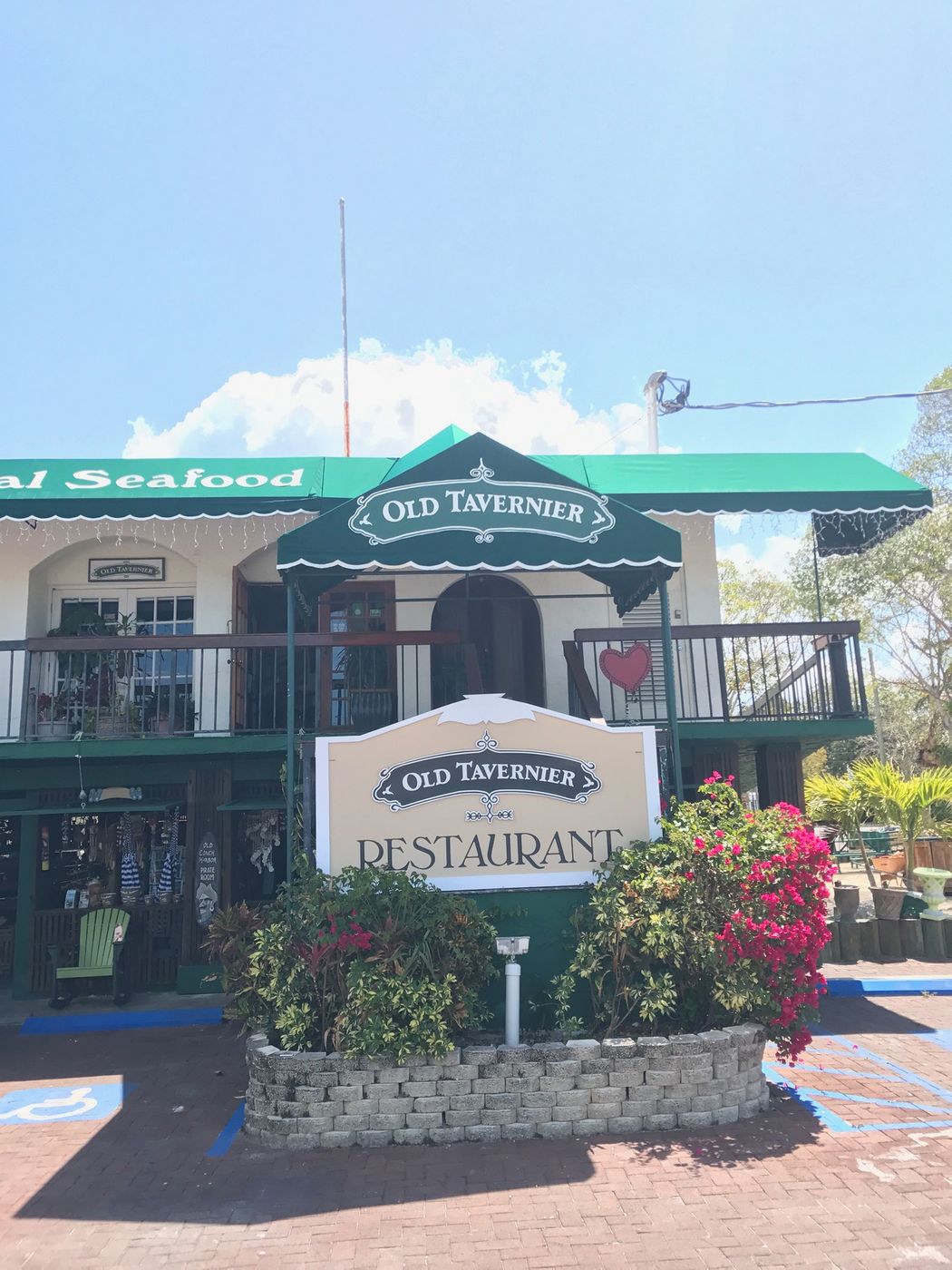 Green awning and sign at the Old Tavernier Restaurant