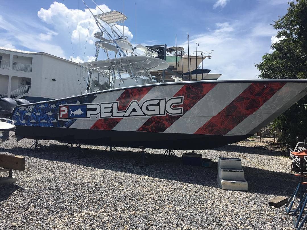 Pelagic center console with a red, white and blue stars and stripes wrap