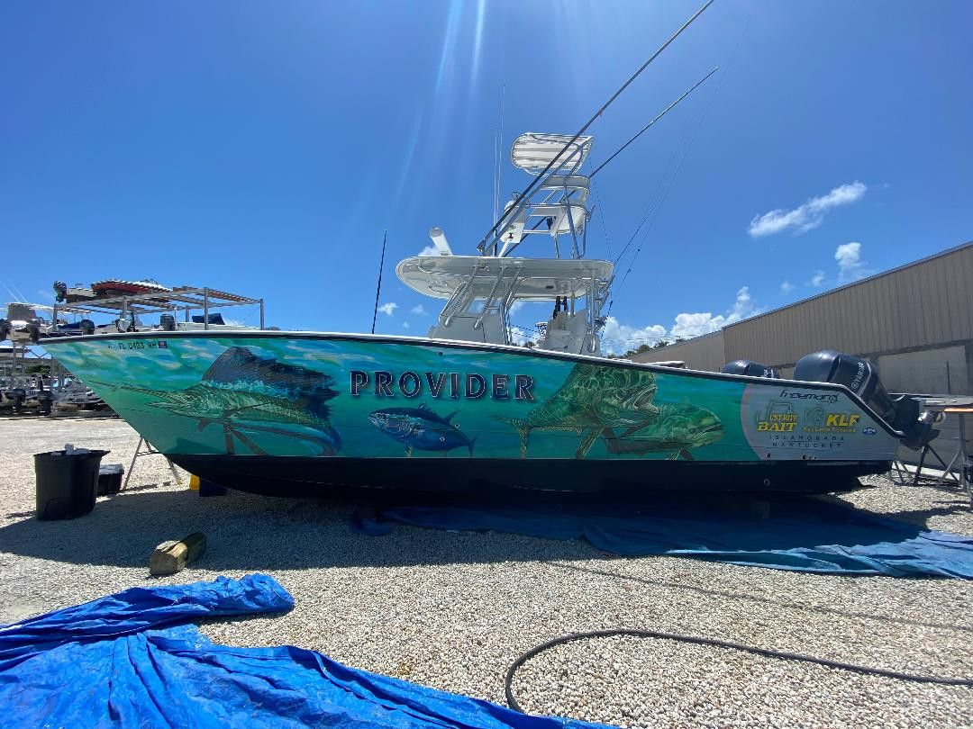 Center console on stands with an ocean wrap lettered Provider