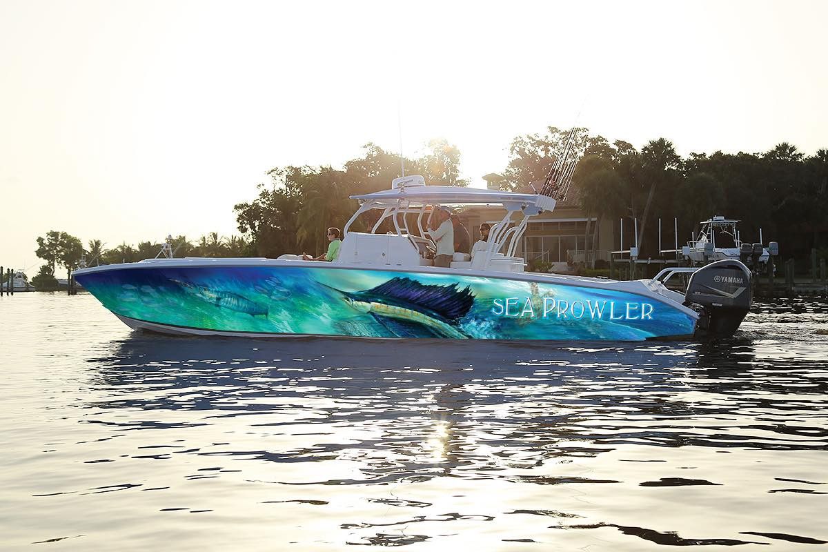 Sea Prowler center console with a sailfish wrap at sunset