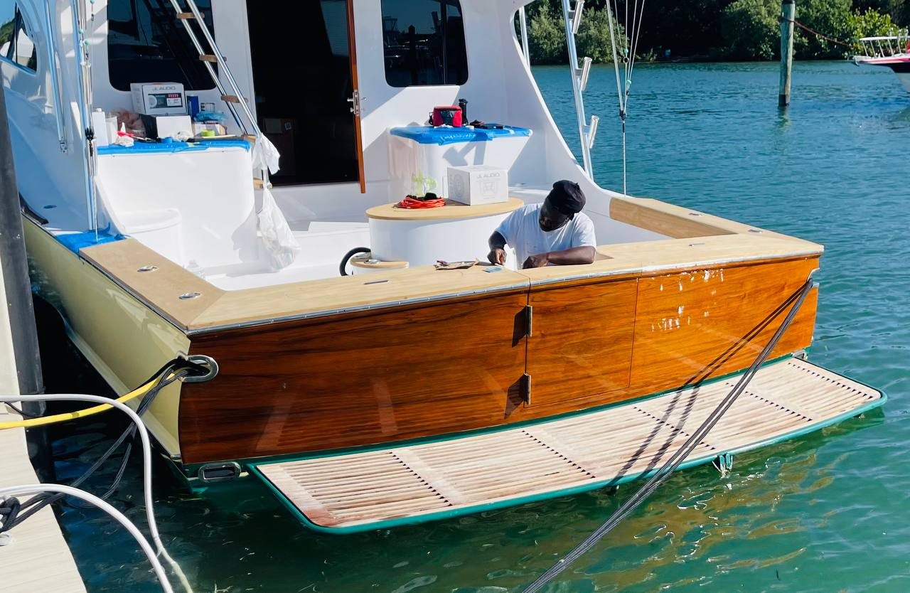 Sportfisher transom with a teak wrap at the dock