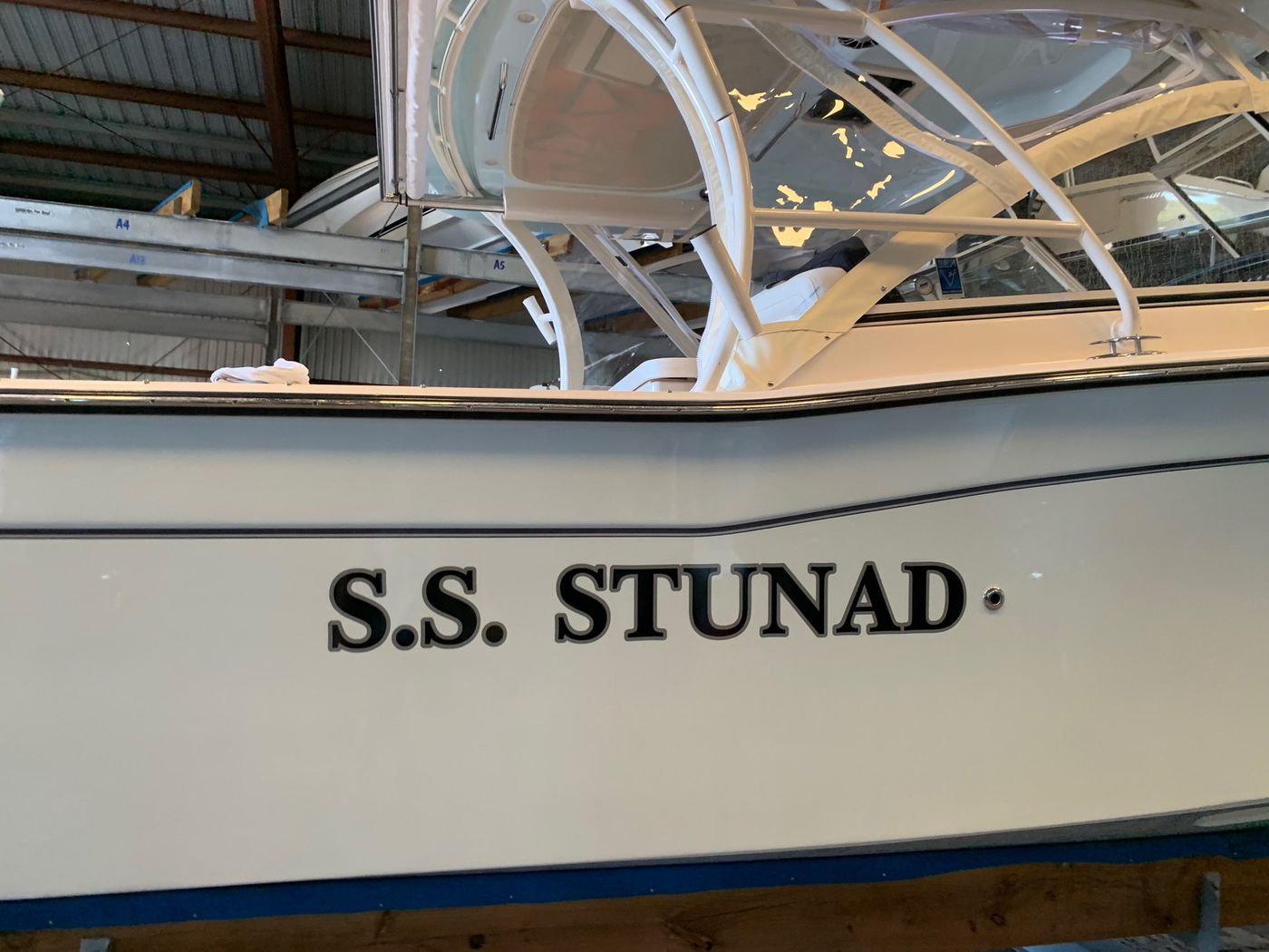 S.S. Stunad boat name in black block letters