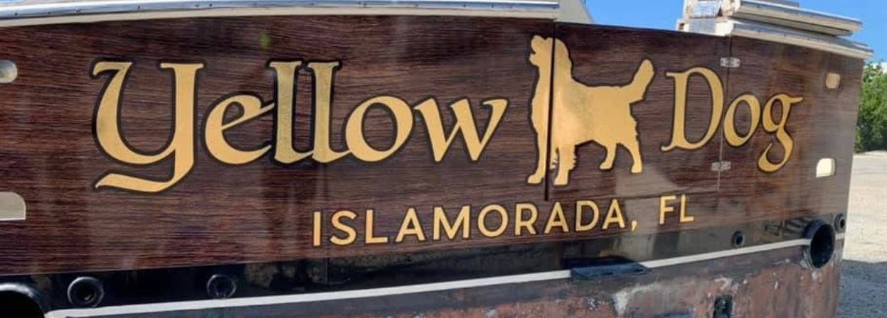 Yellow Dog gold leaf transom lettering with Islamorada FL hailing port